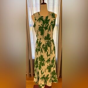 Maxi length sundress made of tight accordion pleated floral fabric.